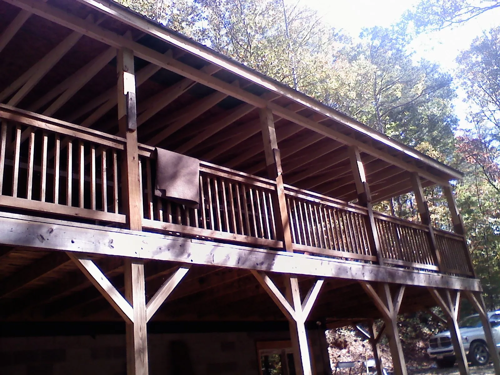 Timber framing under a new elevated porch and deck in Bartonsville
